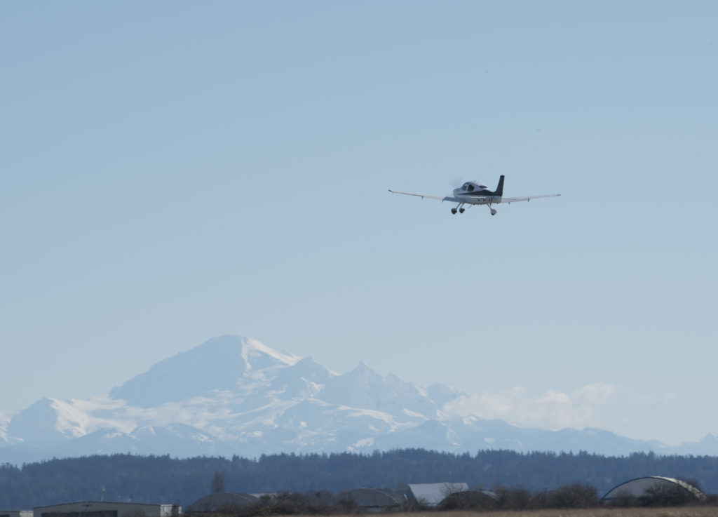 Cirrus SR-20 Taking Off with Mount Baker in Background