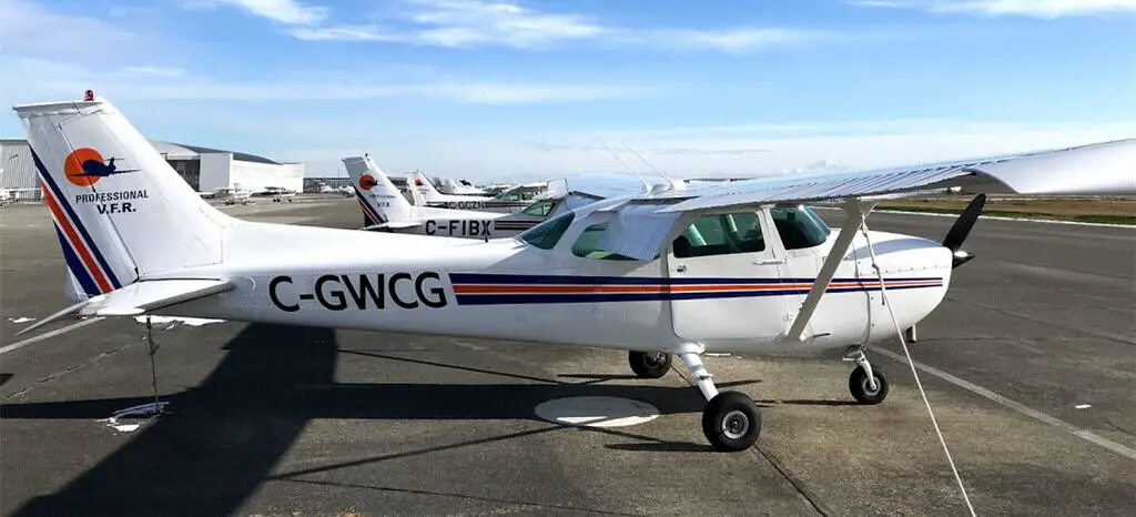 Pro's Cessna 172 and Cessna 152 Aircraft Parked on Ramp at Boundary Bay Airport